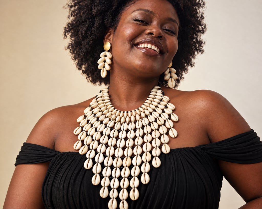 Cowrie disc drop earrings and bib necklace set worn